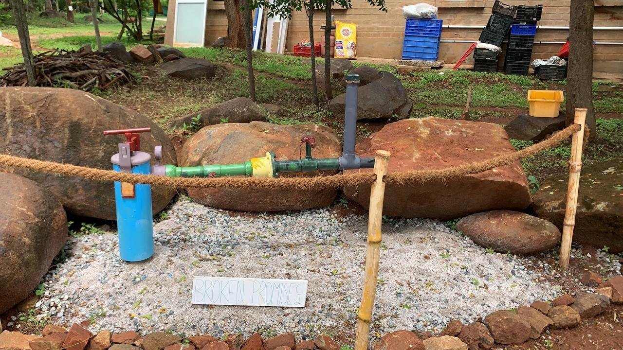 Broken Promises recycled-material art installation at Rassba Farm